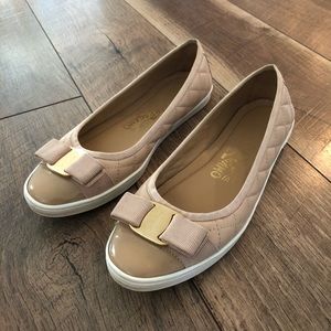 Woman’s Ferragamo pale pink flats.